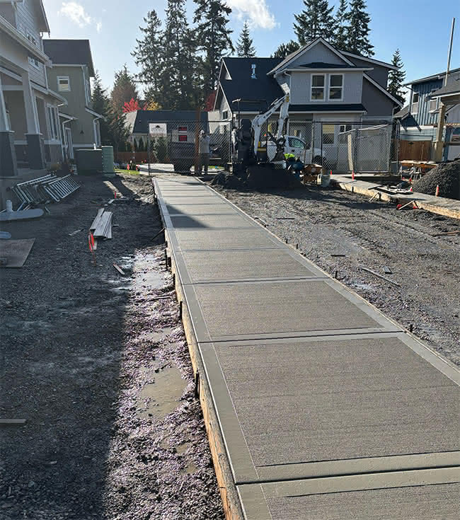 Home 8 development sidewalk construction project